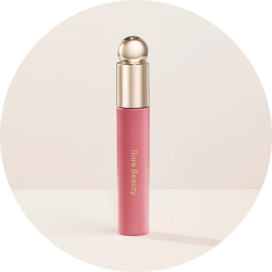 Soft Pinch Tinted Lip Oil being held in one hand